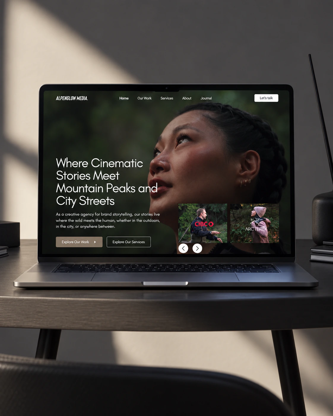 Alpenglow Media homepage on a laptop: cinematic hero for mountain and city brand films